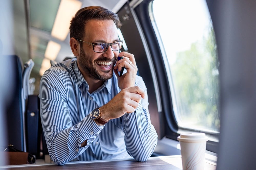 Man on Phone on Train 