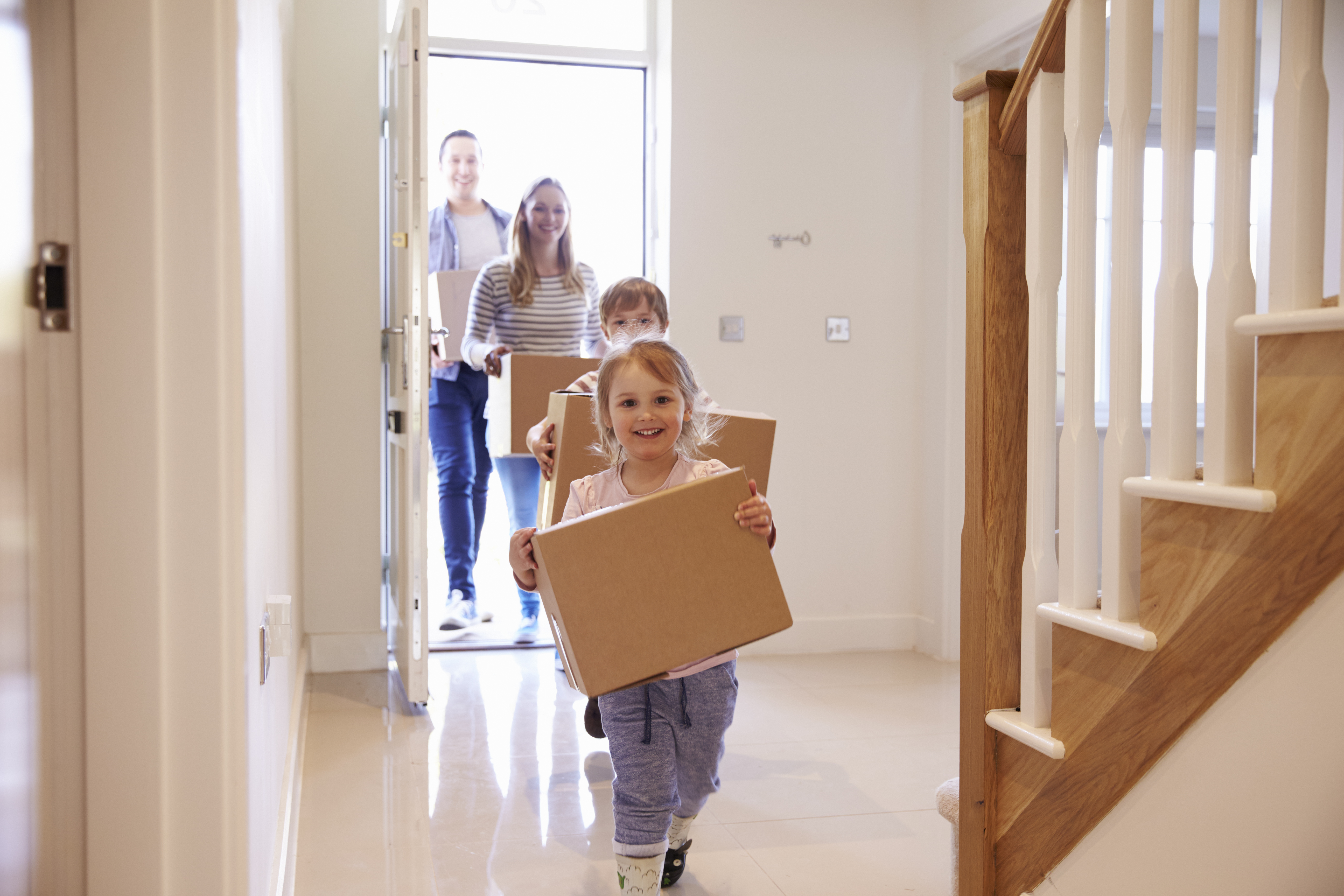 Family-Moving-Into-Home